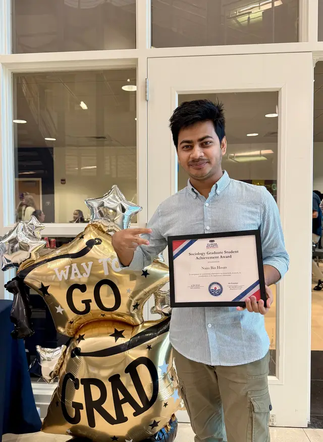 Naim Bin Hasan receiving the Florida Atlantic University Sociology Graduate Student Achievement Award, April 2026.