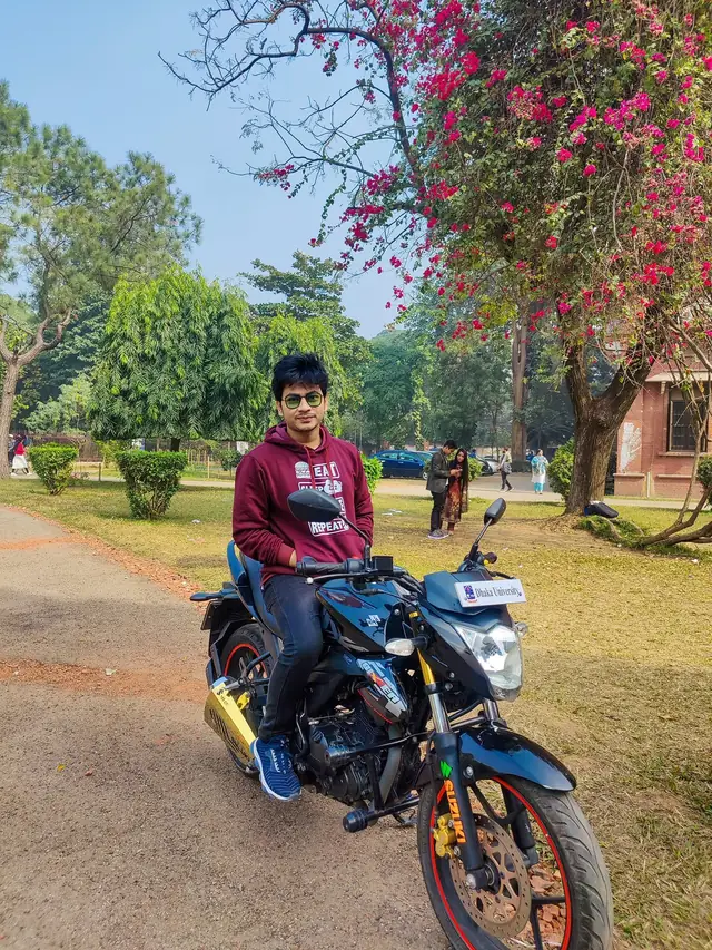 Naim Bin Hasan on his motorbike on the University of Dhaka campus.